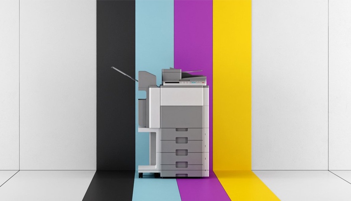 Photocopier with CYMK striped backdrop